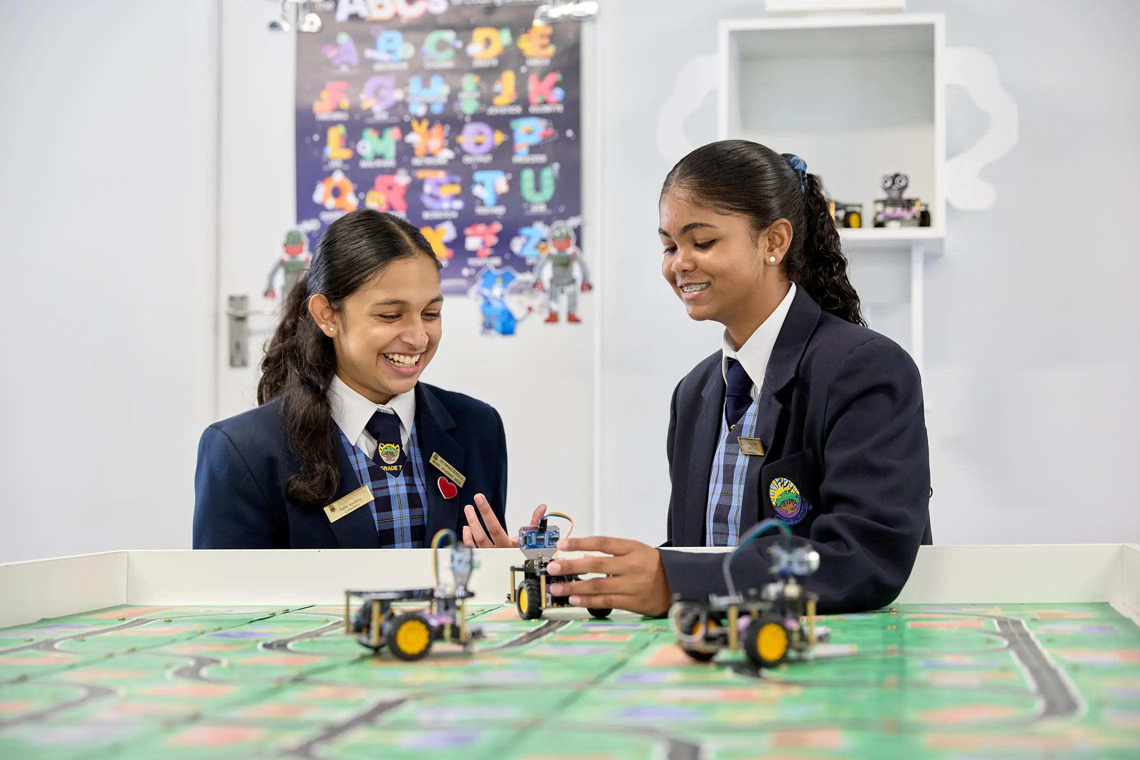Summerhill students programming robots together
