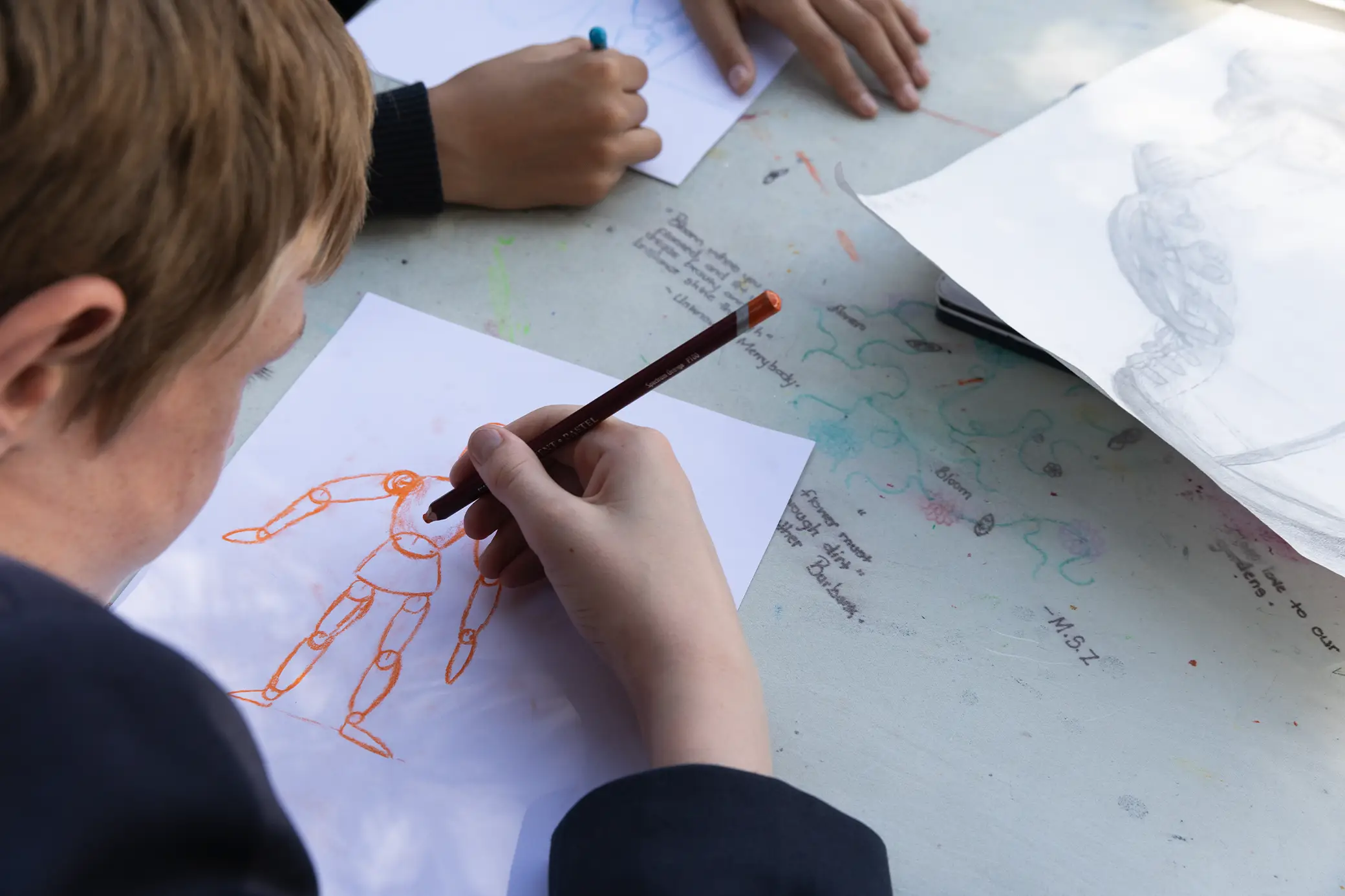 Student sketching in art class at Summerhill Prep