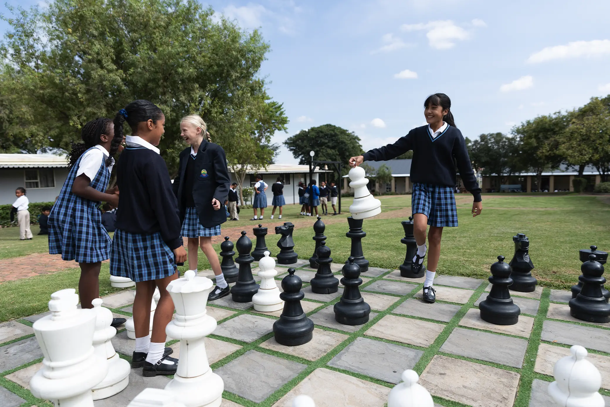 Prep School students playing giant chess on campus